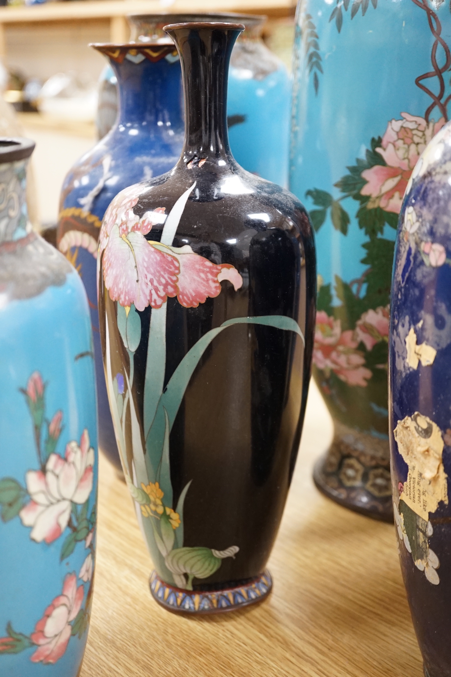 Seven Japanese cloisonné enamel vases, enamelled with dragons, flowers and birds, largest 40cm high